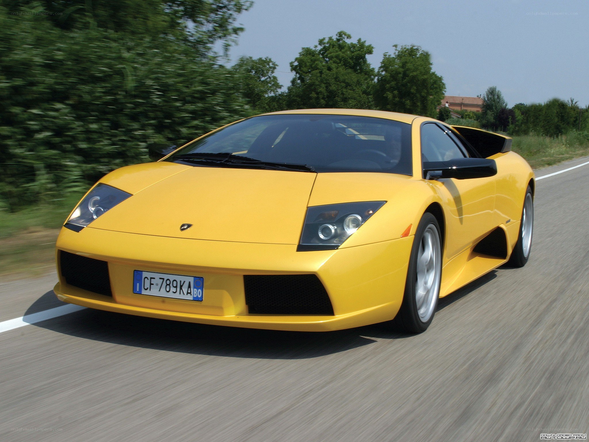 yellow lamborghini on road