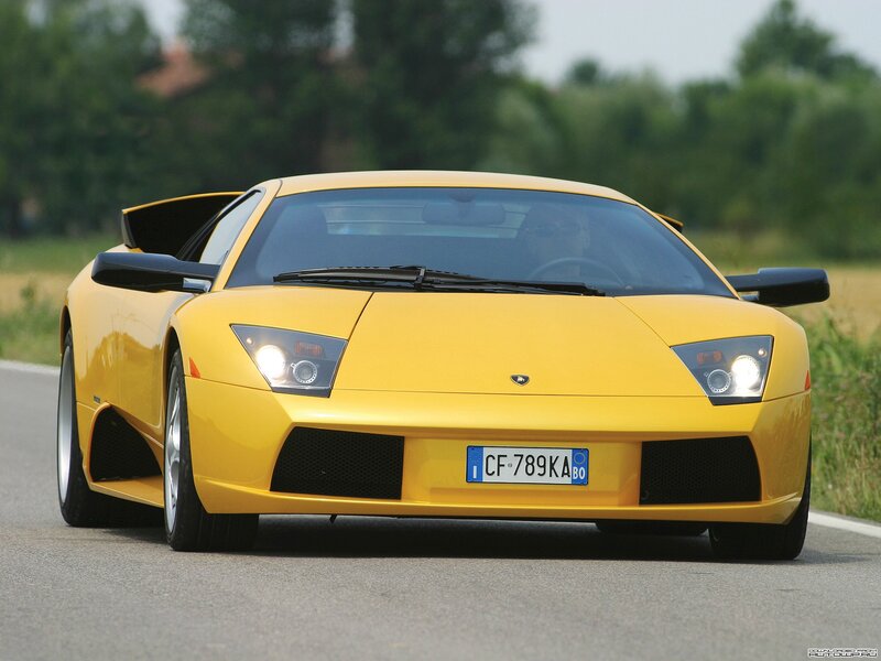 yellow lamborghini on road