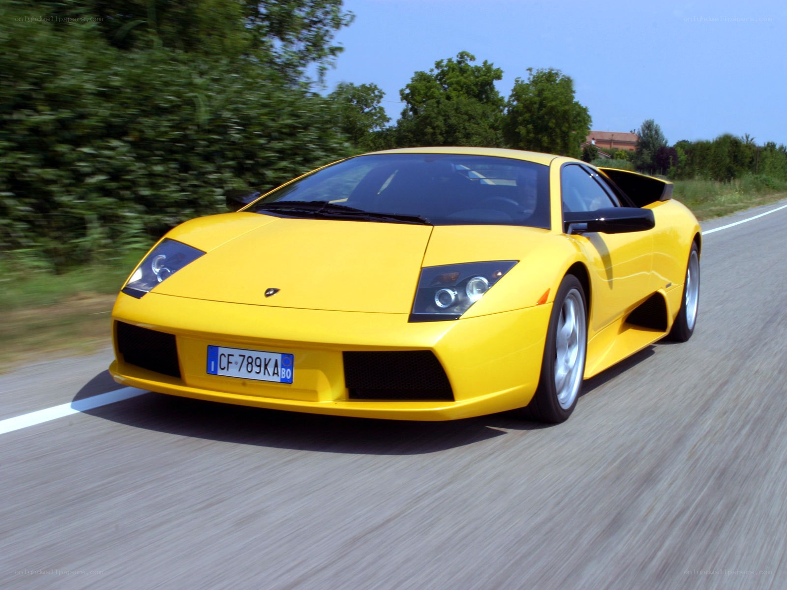 yellow lamborghini on road