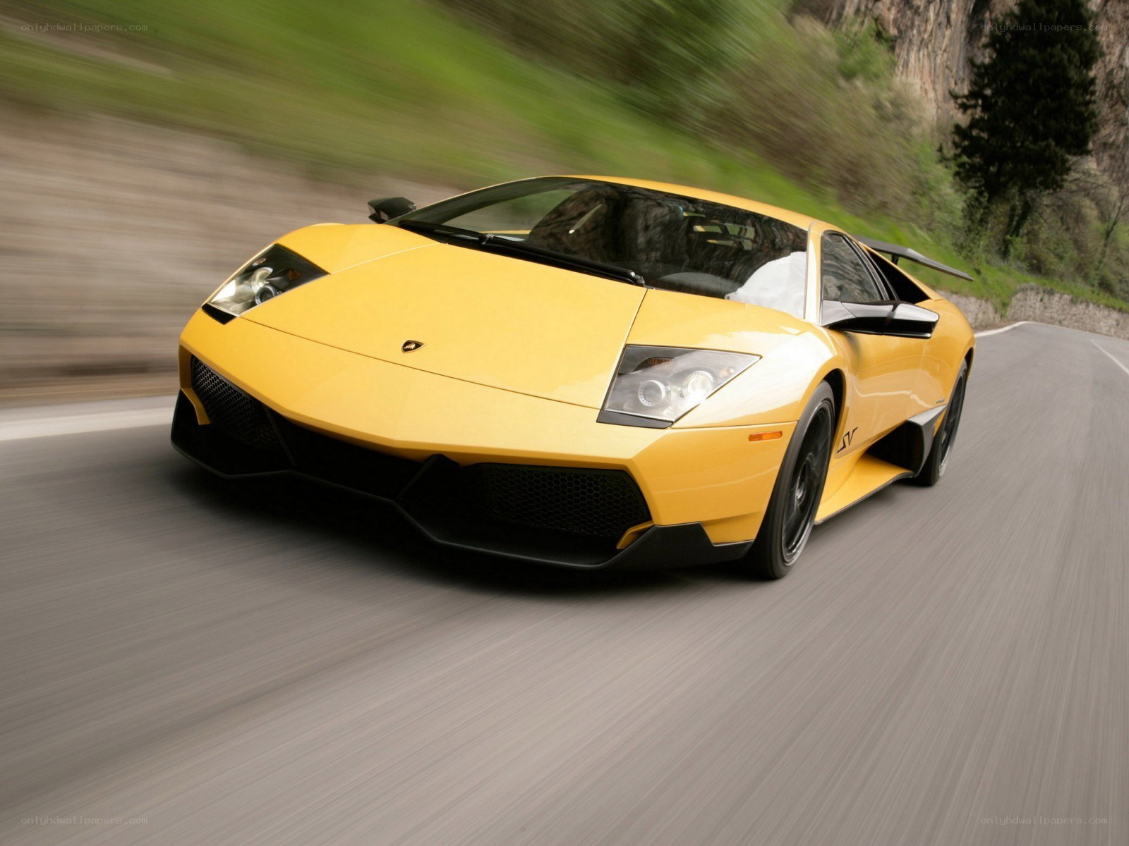 yellow lamborghini on road