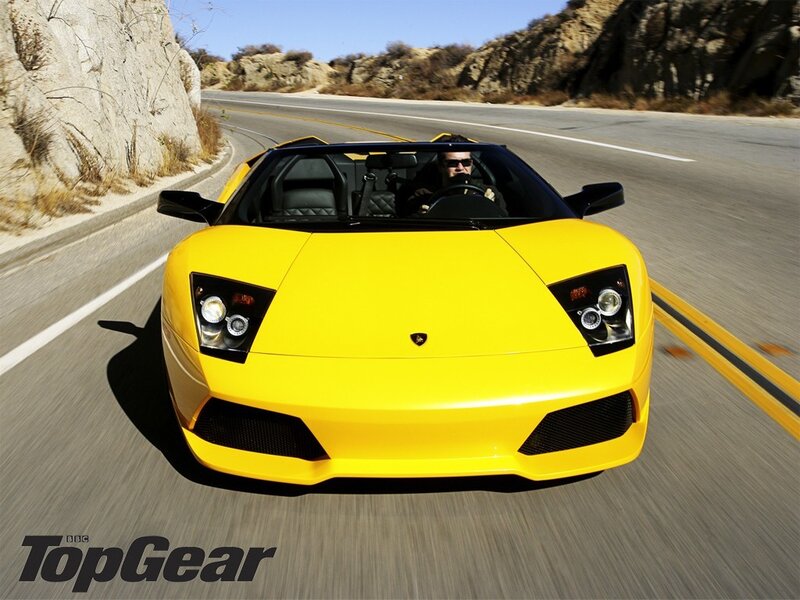 yellow lamborghini on road