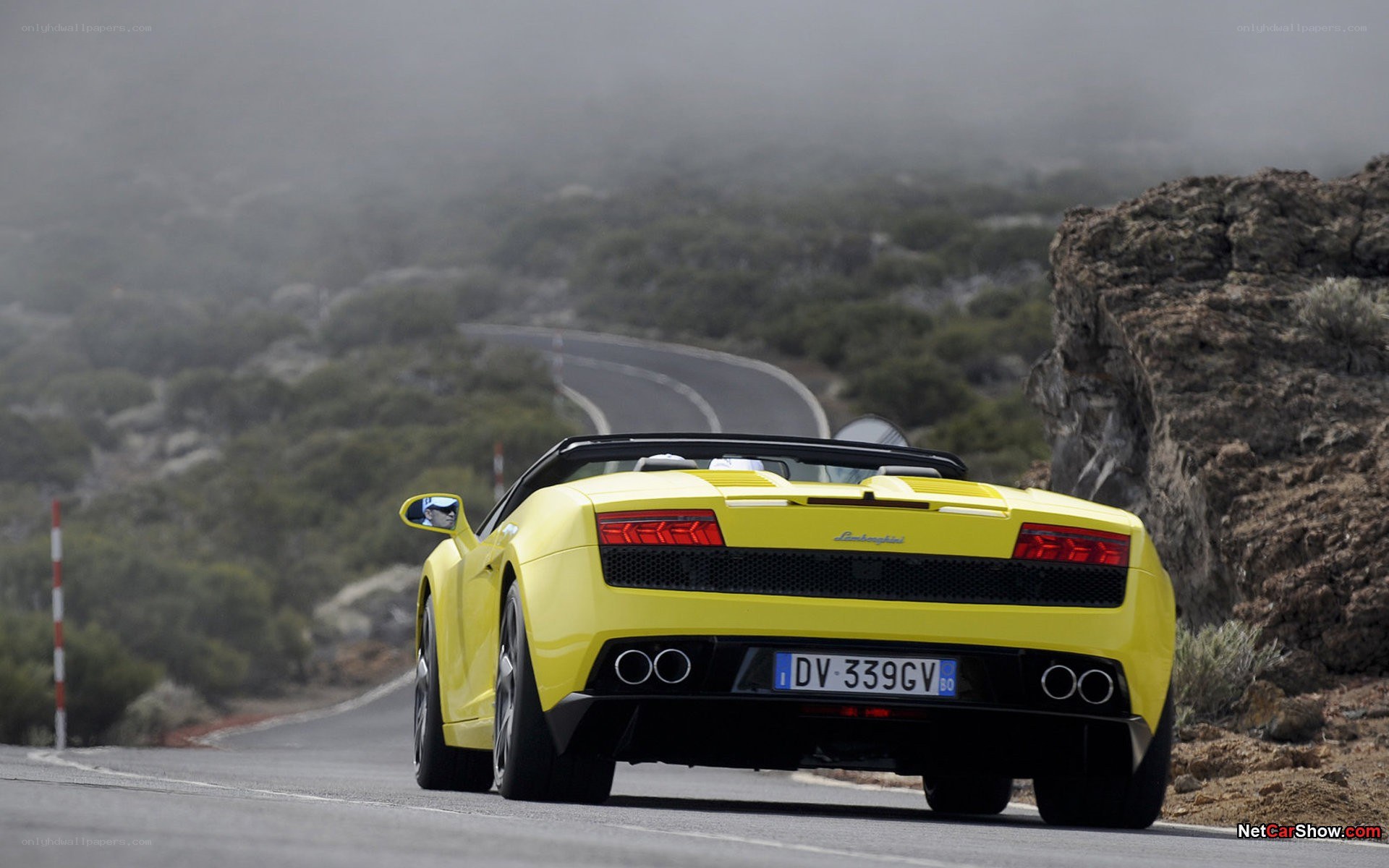 Yellow Lamborghini on winding road