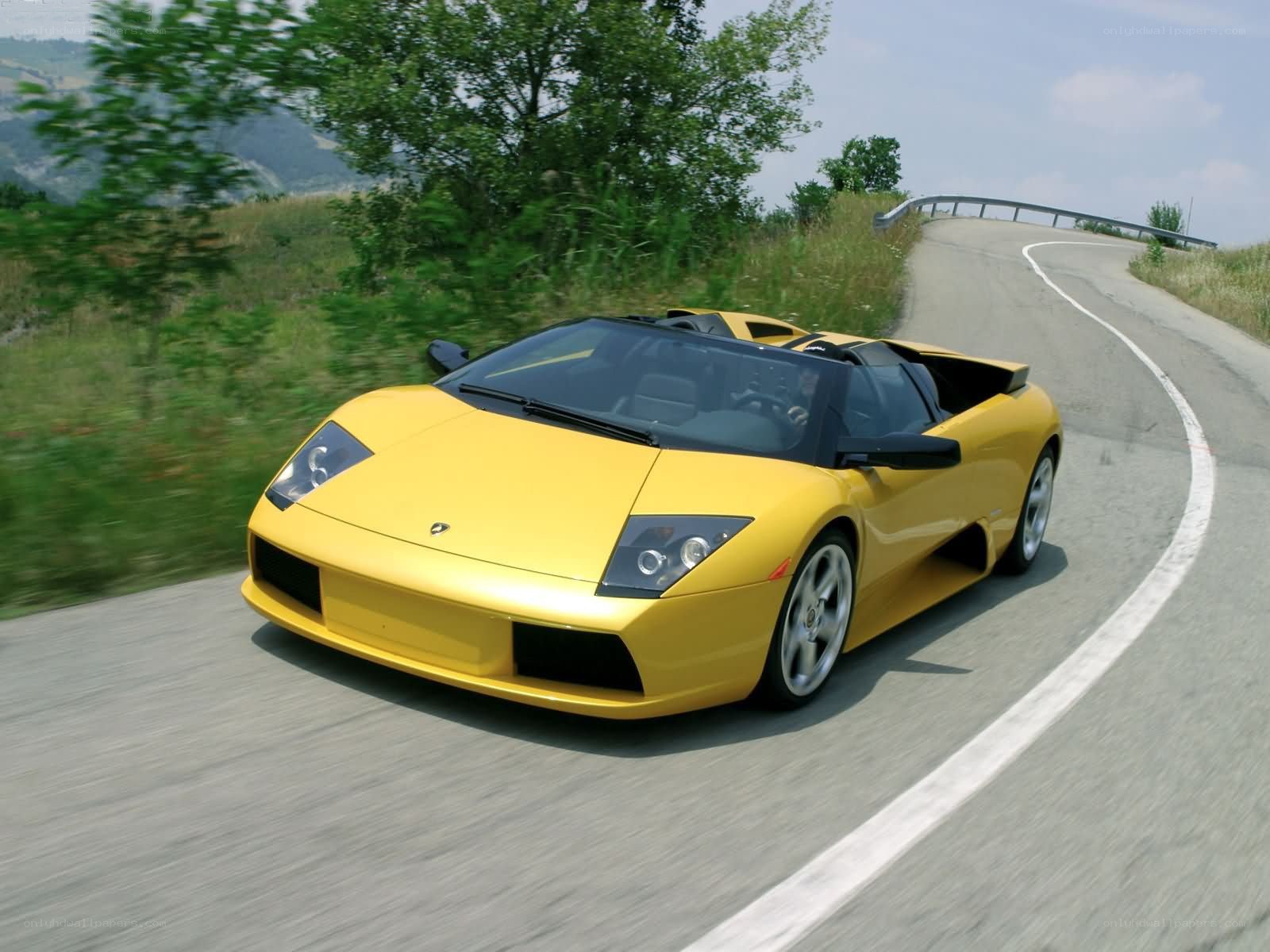 Yellow Lamborghini on winding road