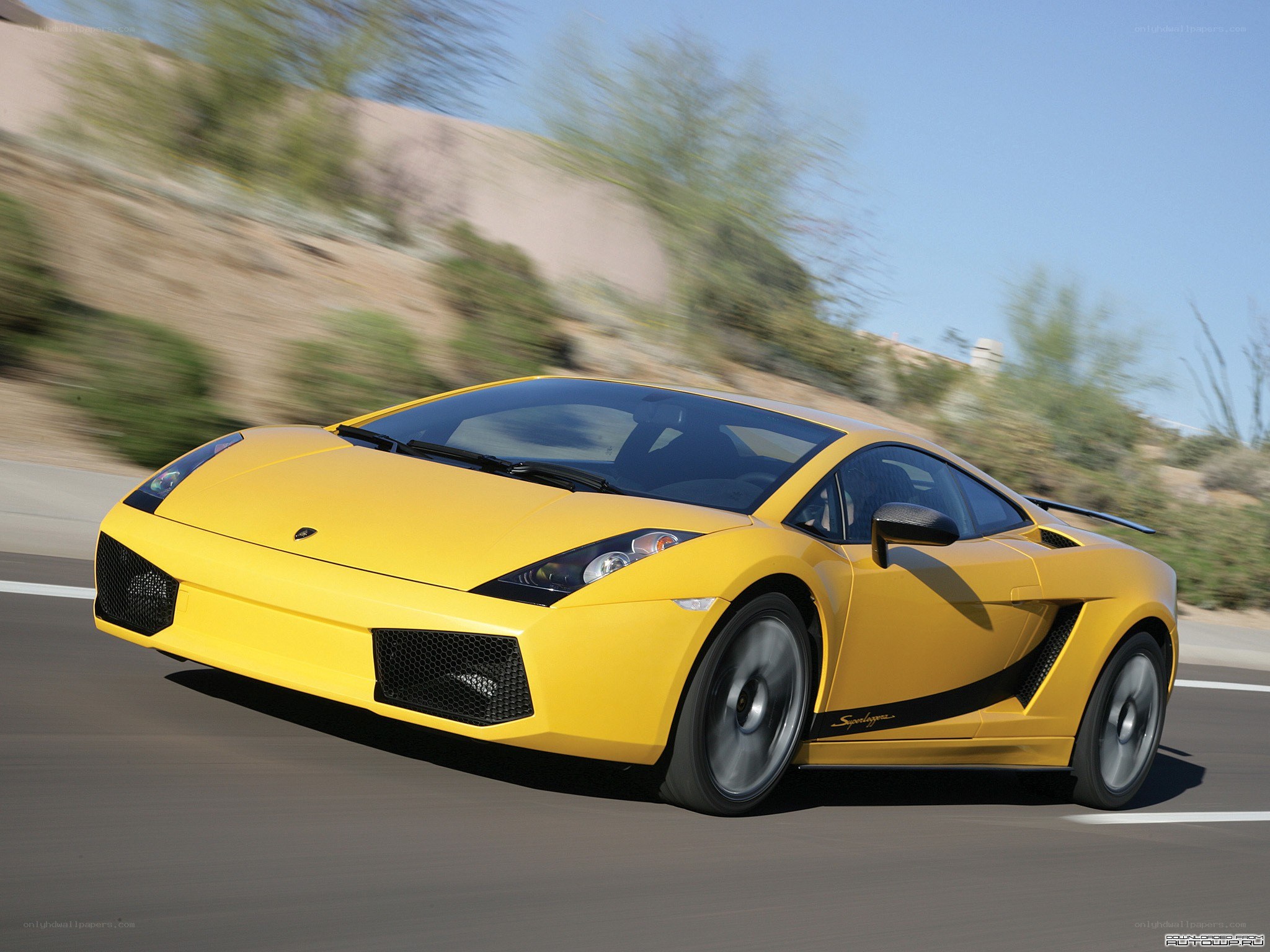 yellow lamborghini speeding on road