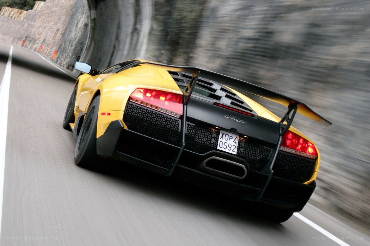 Yellow Lamborghini speeding on road