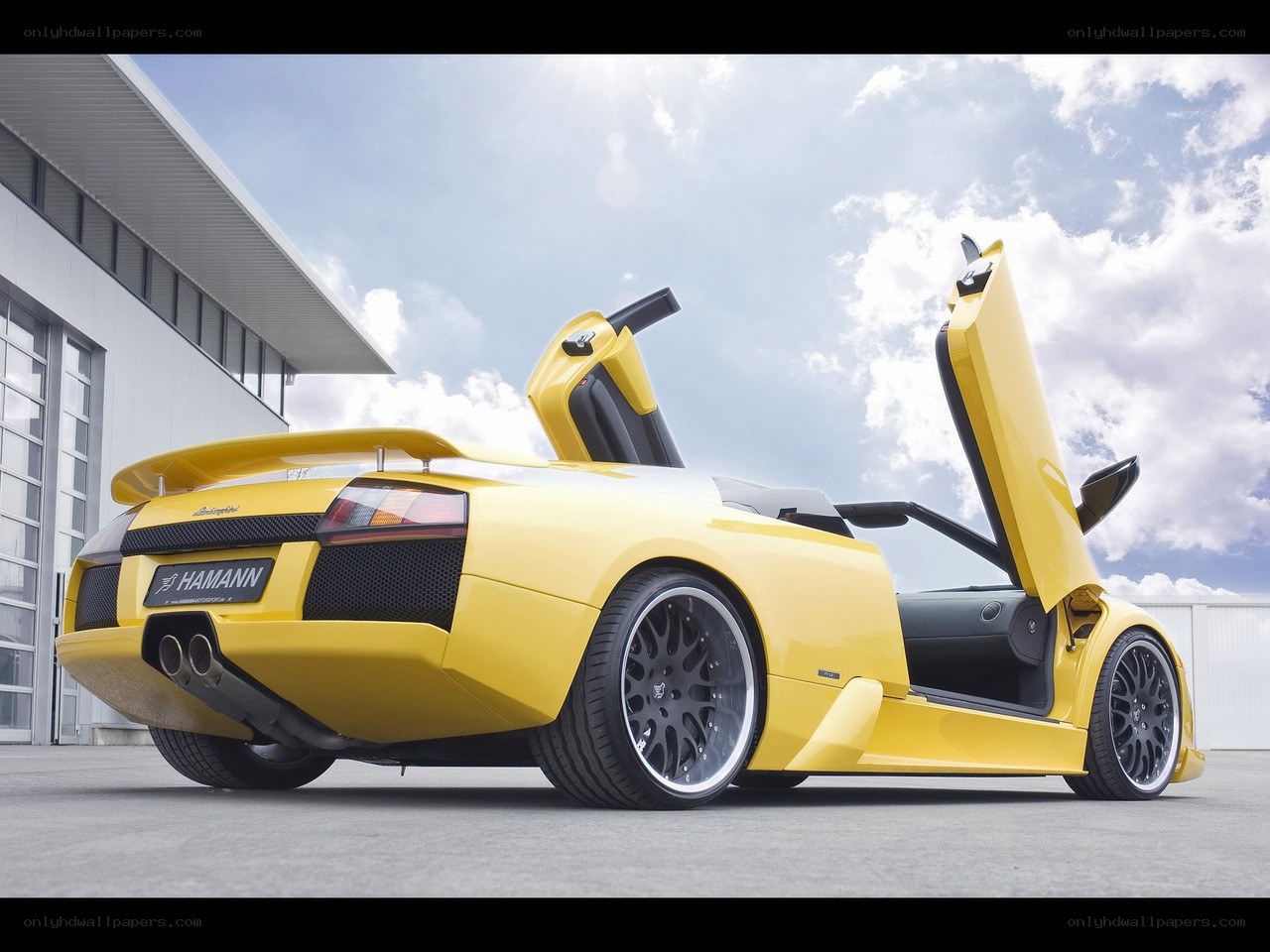 Yellow Lamborghini with doors open