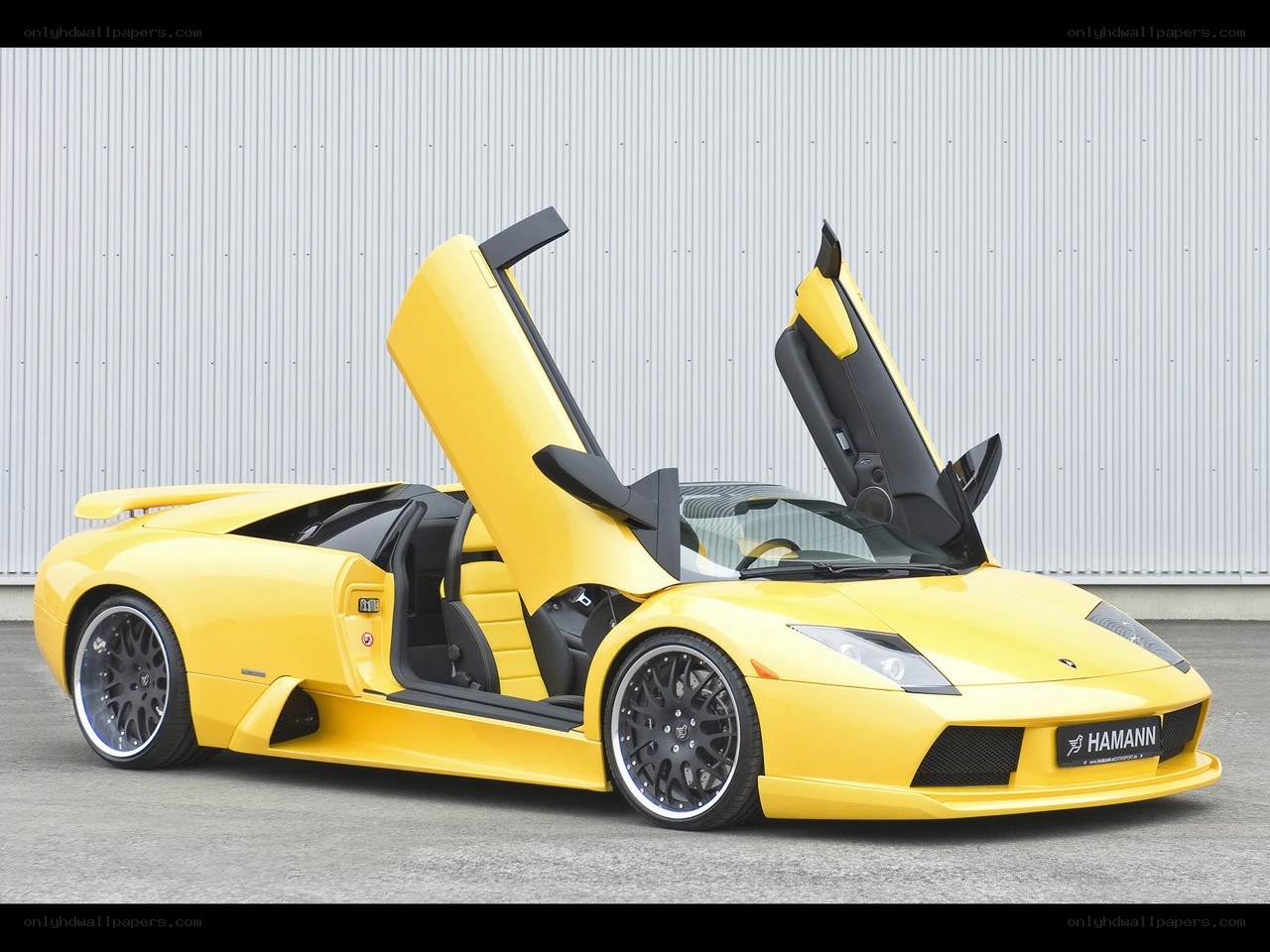 Yellow Lamborghini with doors open