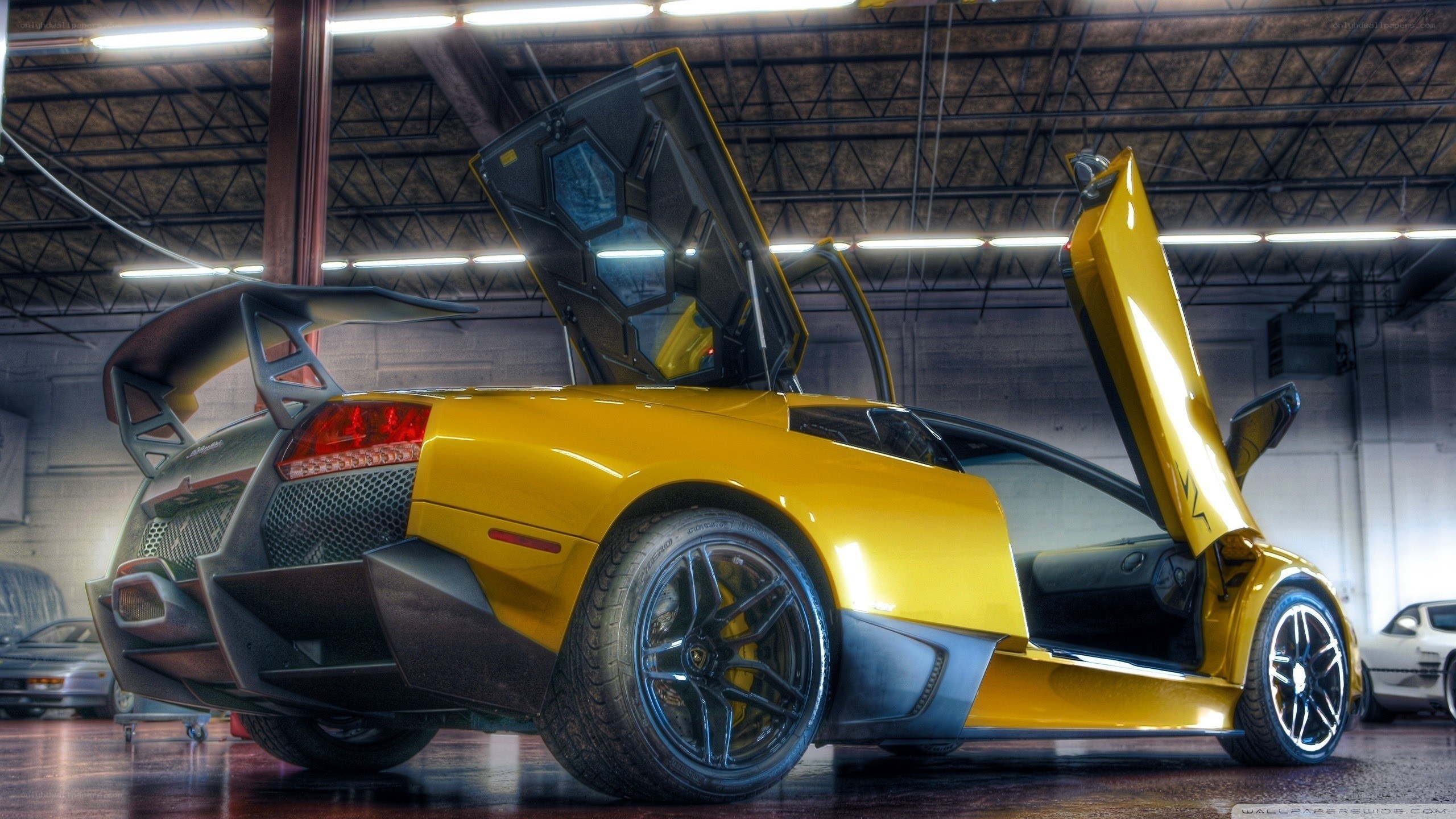 Yellow Lamborghini with doors open