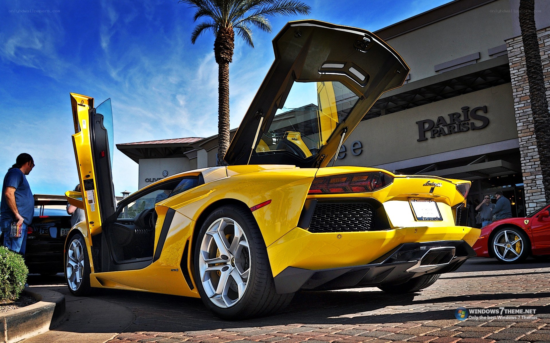 Yellow Lamborghini with doors open