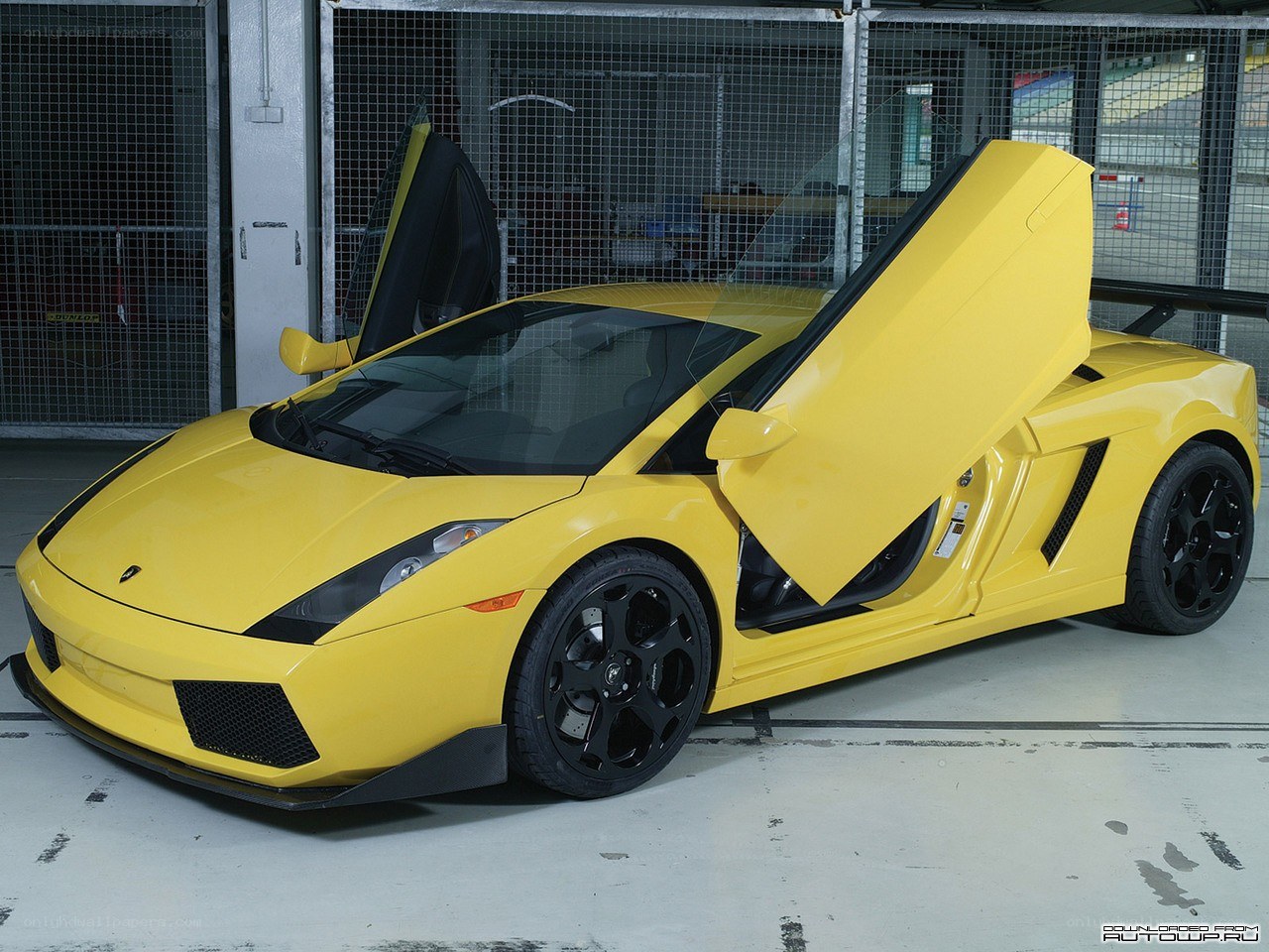 yellow Lamborghini with doors open