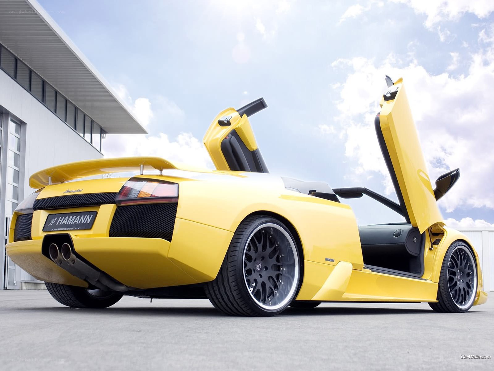 Yellow Lamborghini with doors open