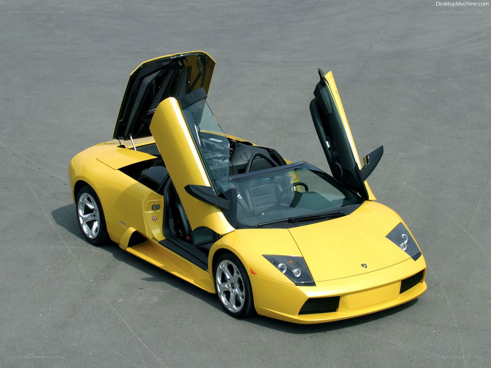 yellow lamborghini with doors open