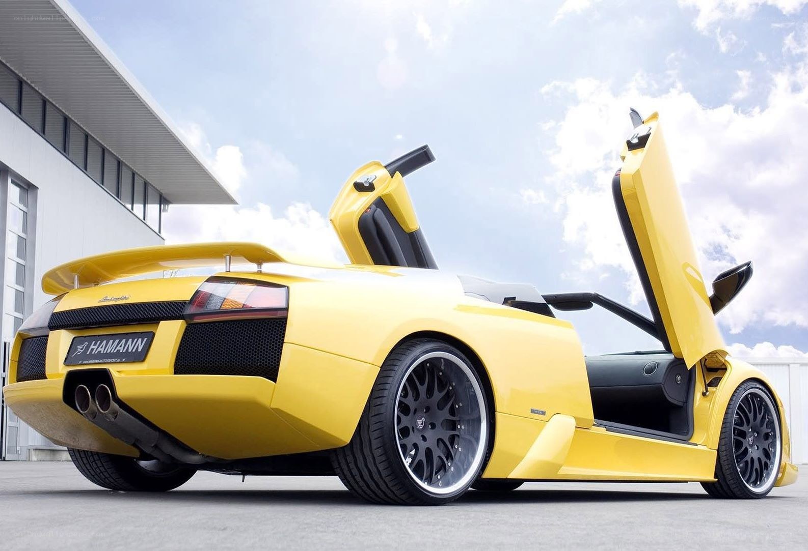 Yellow Lamborghini with doors open