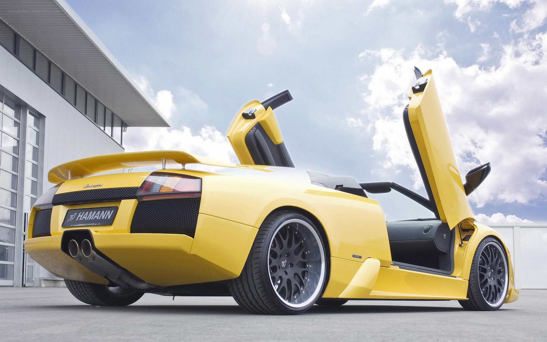 Yellow Lamborghini with doors open