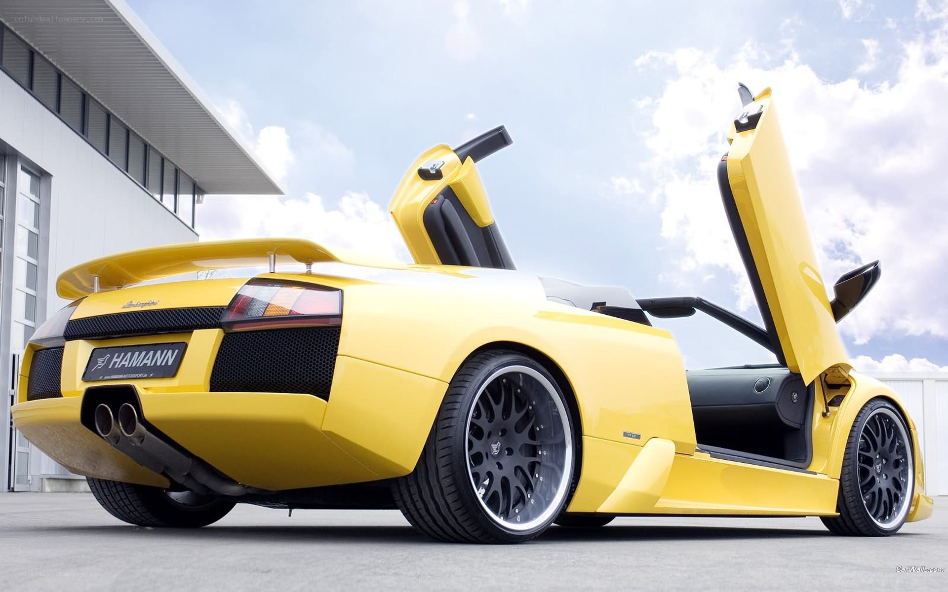 yellow lamborghini with doors open
