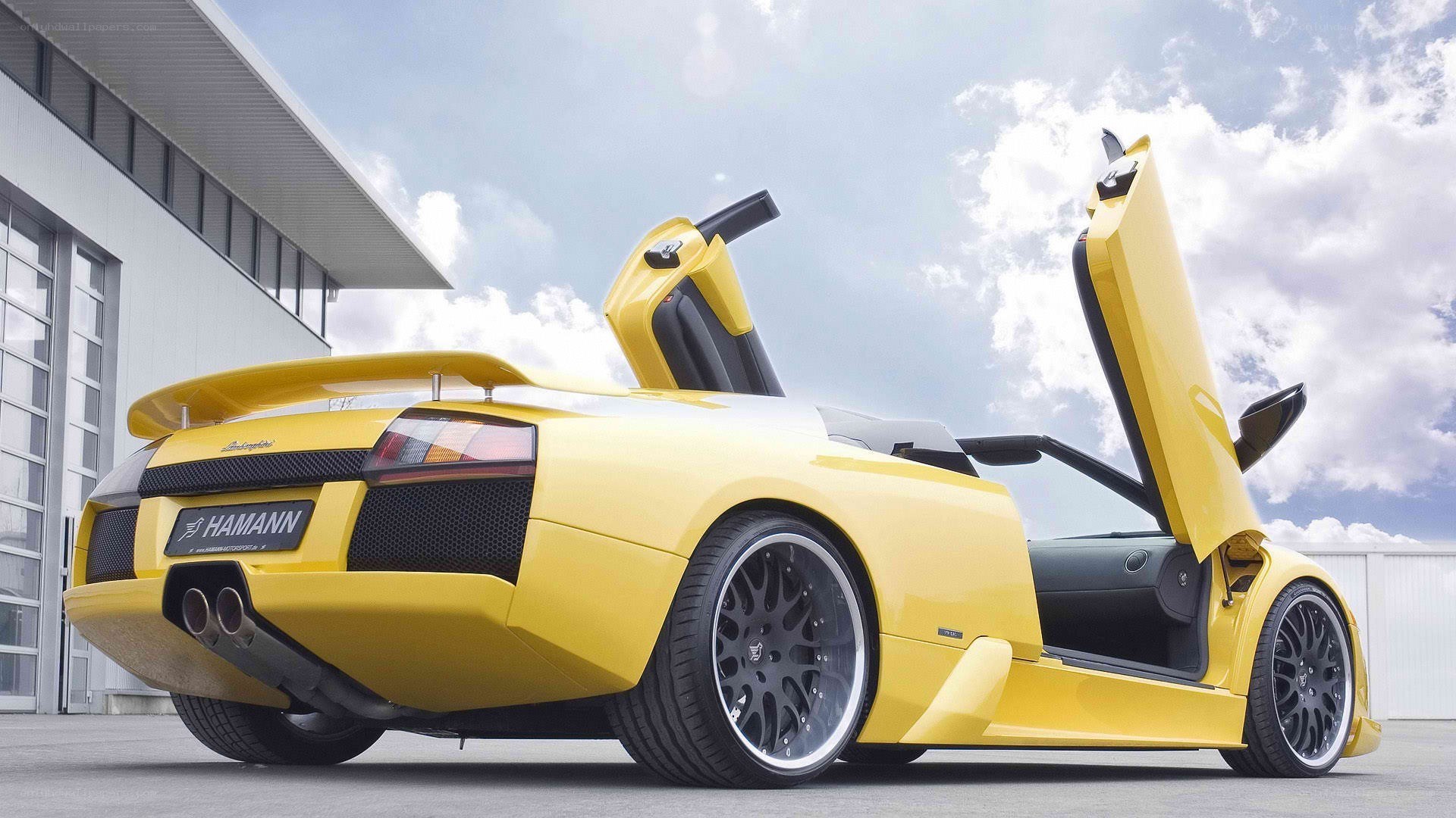 Yellow Lamborghini with doors open