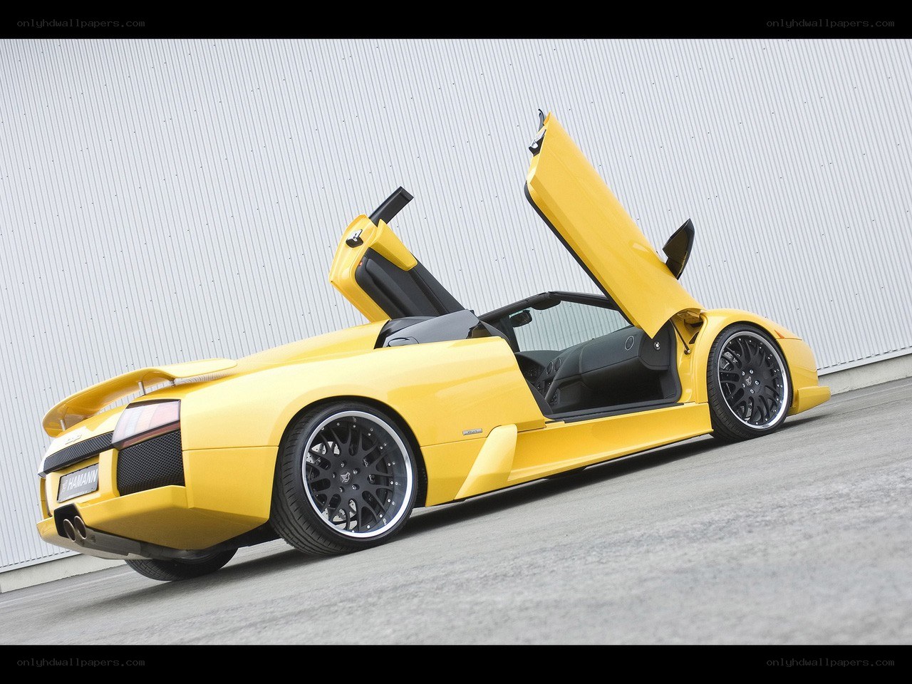 Yellow Lamborghini with doors open