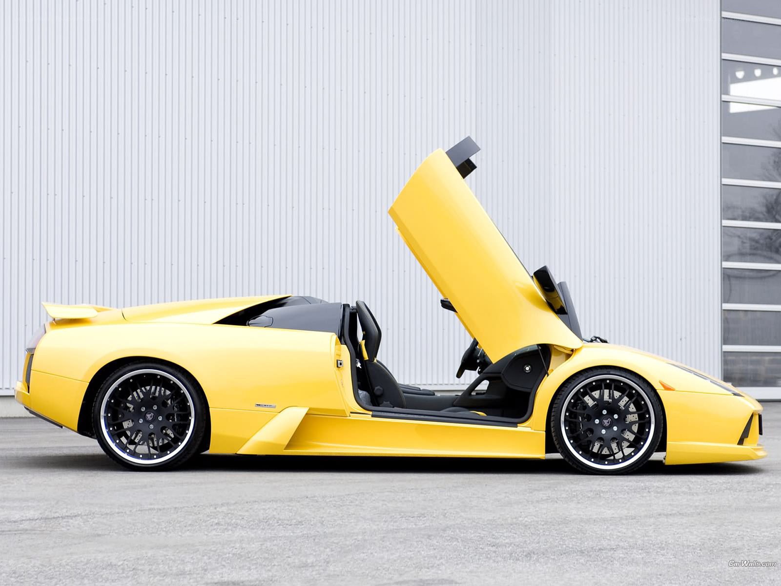 Yellow Lamborghini with open door