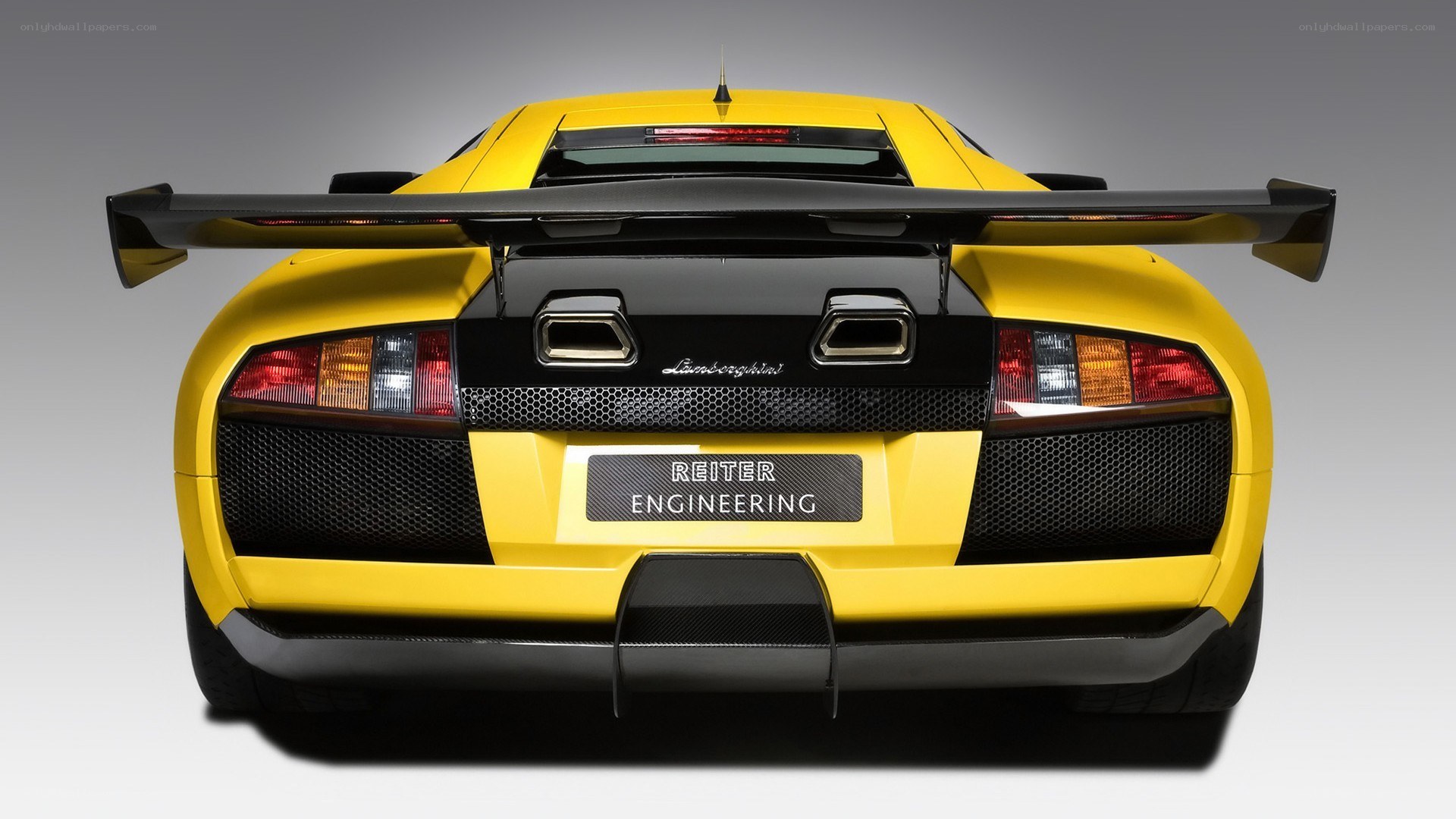 yellow lamborghini with rear wing