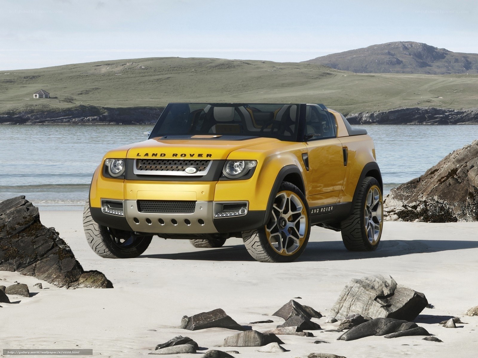 Yellow Land Rover on beach