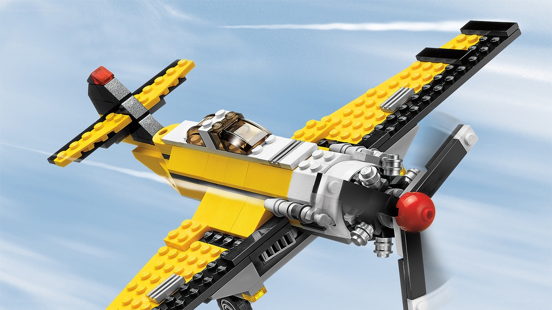 yellow lego airplane in flight