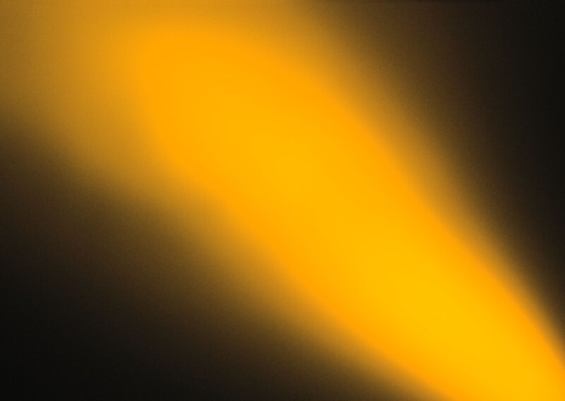 yellow light beam on dark background