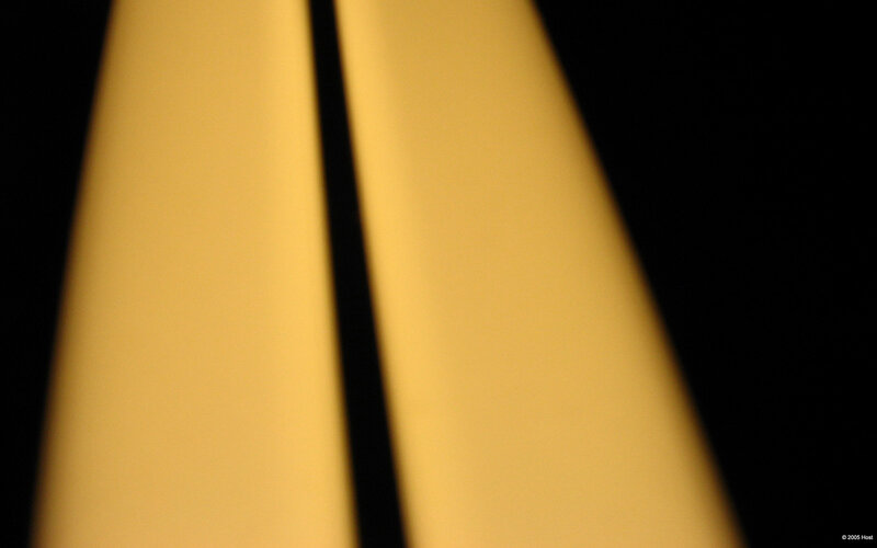 yellow light beams on black
