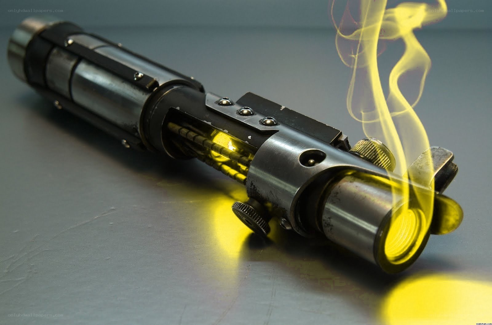 yellow lightsaber with smoke