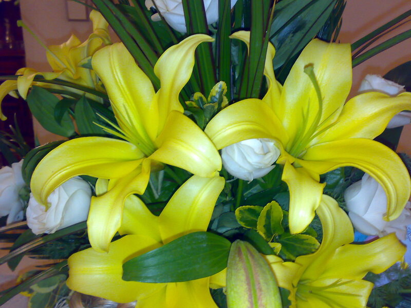 Yellow lilies and white roses