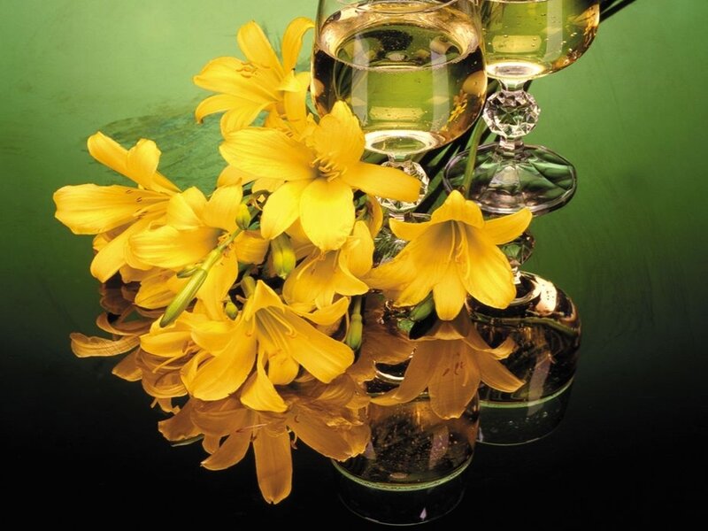 Yellow lilies and wine glasses