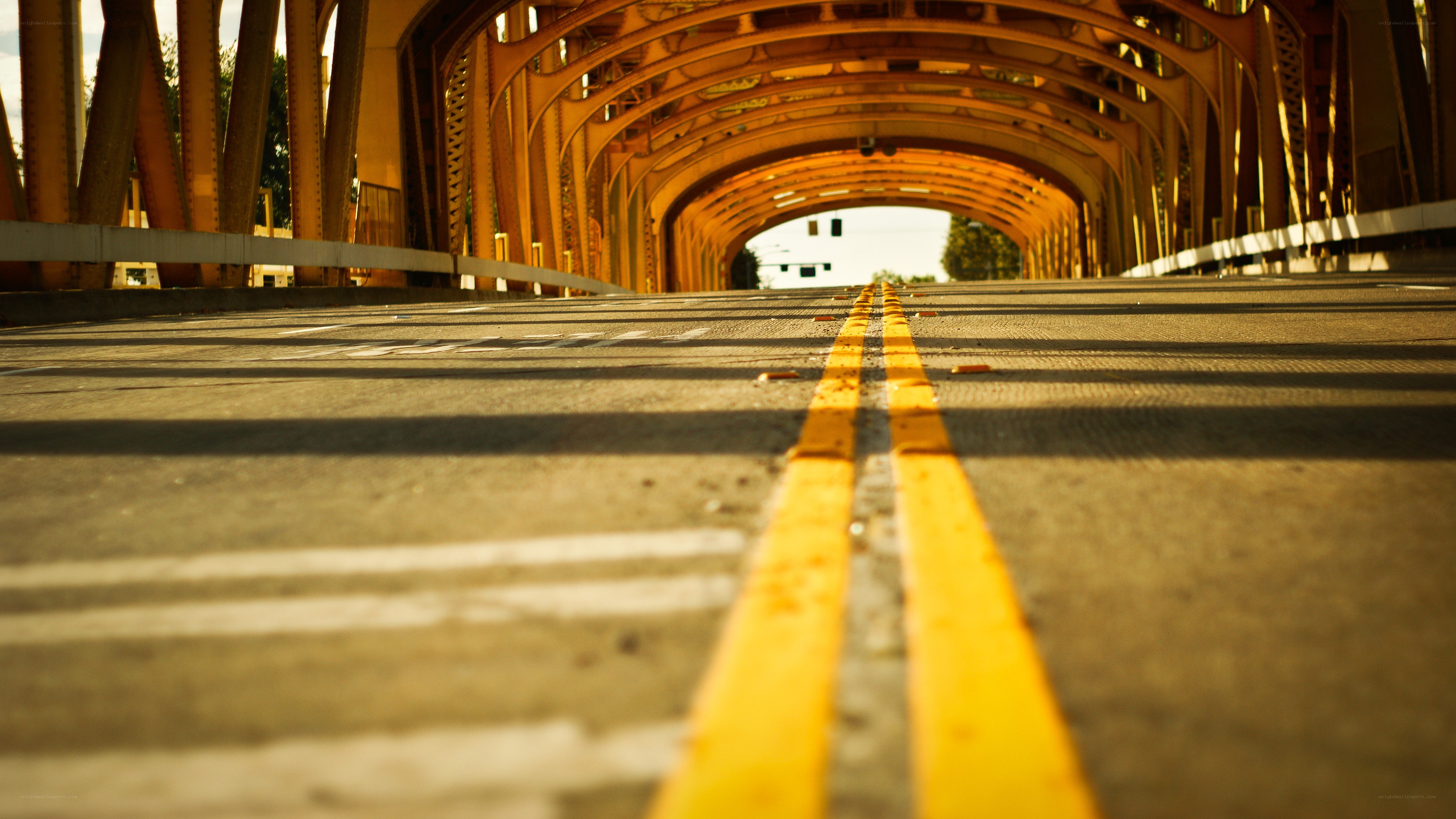 yellow lines on a bridge