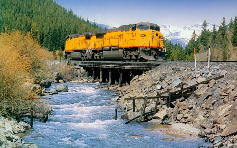 Yellow Locomotive on Bridge