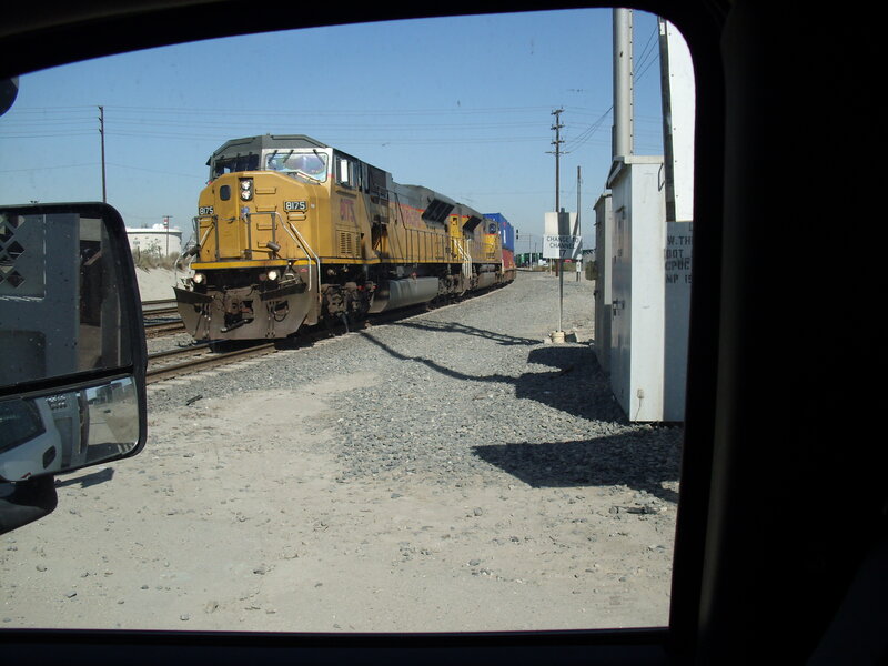 Yellow Locomotive on Tracks — Industrial