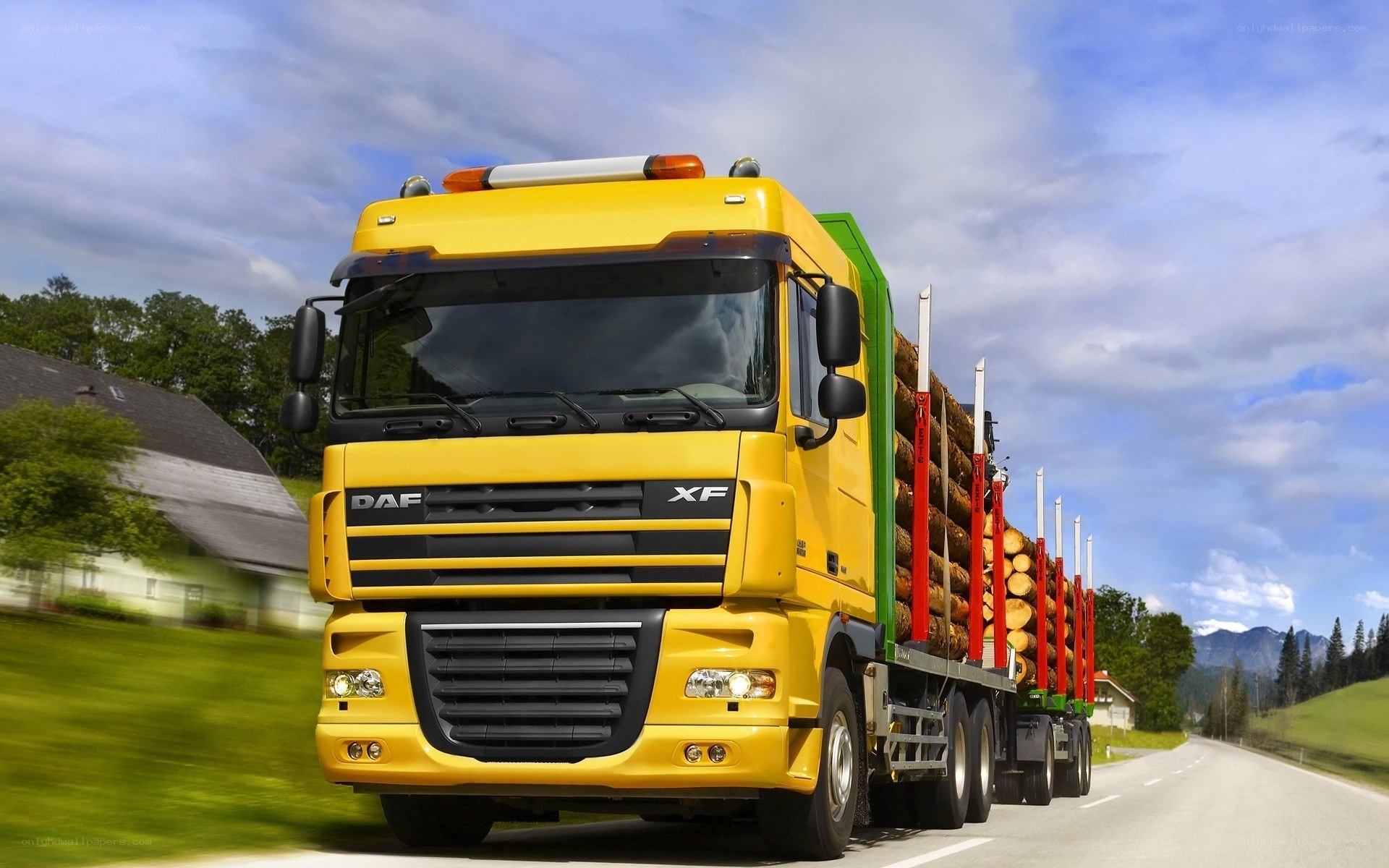 Yellow logging truck on road