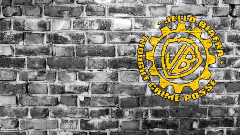 yellow logo on brick wall