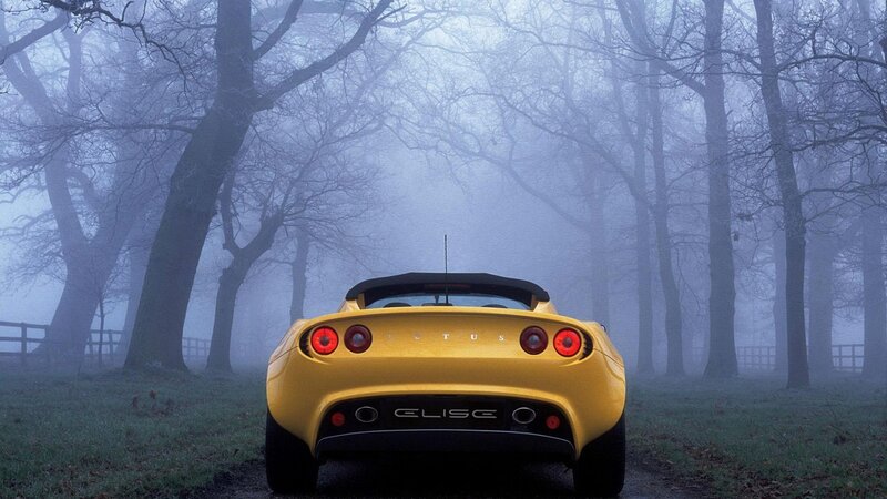 Yellow Lotus Elise in fog
