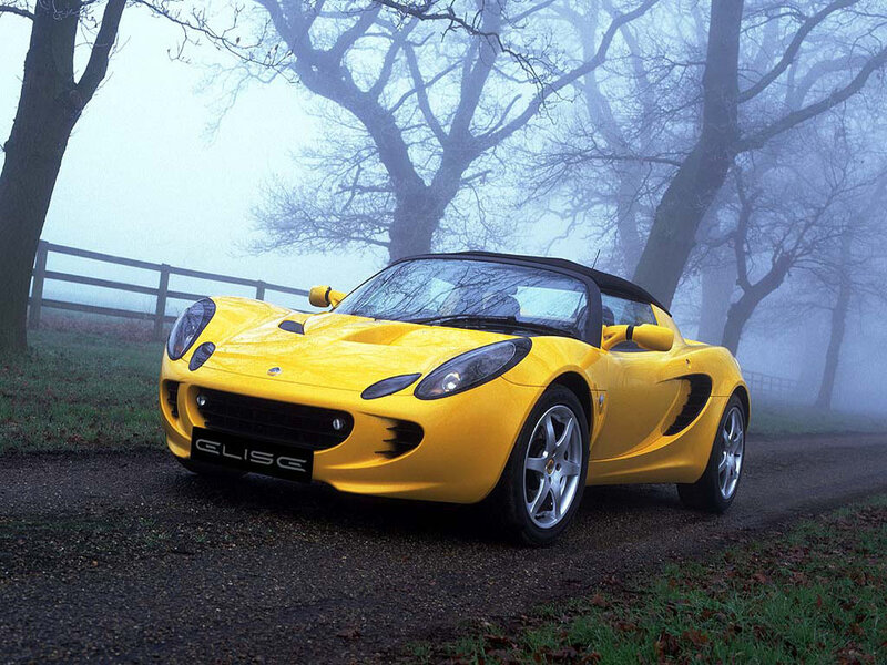 Yellow Lotus Elise in fog