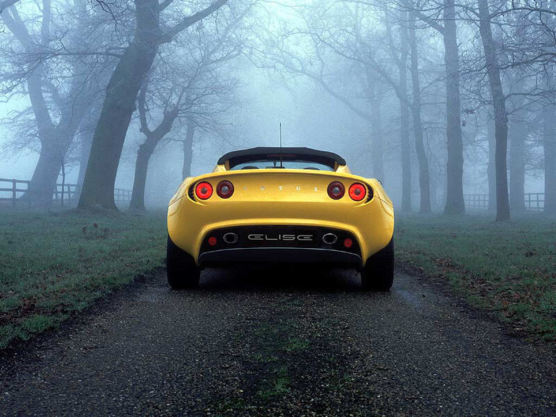Yellow Lotus Elise in fog