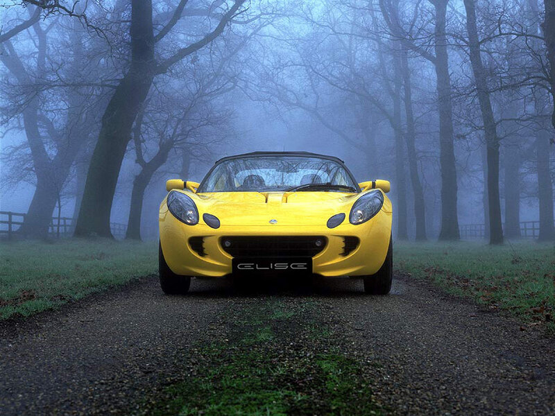 Yellow Lotus Elise in fog