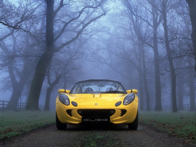 Yellow Lotus Elise in fog