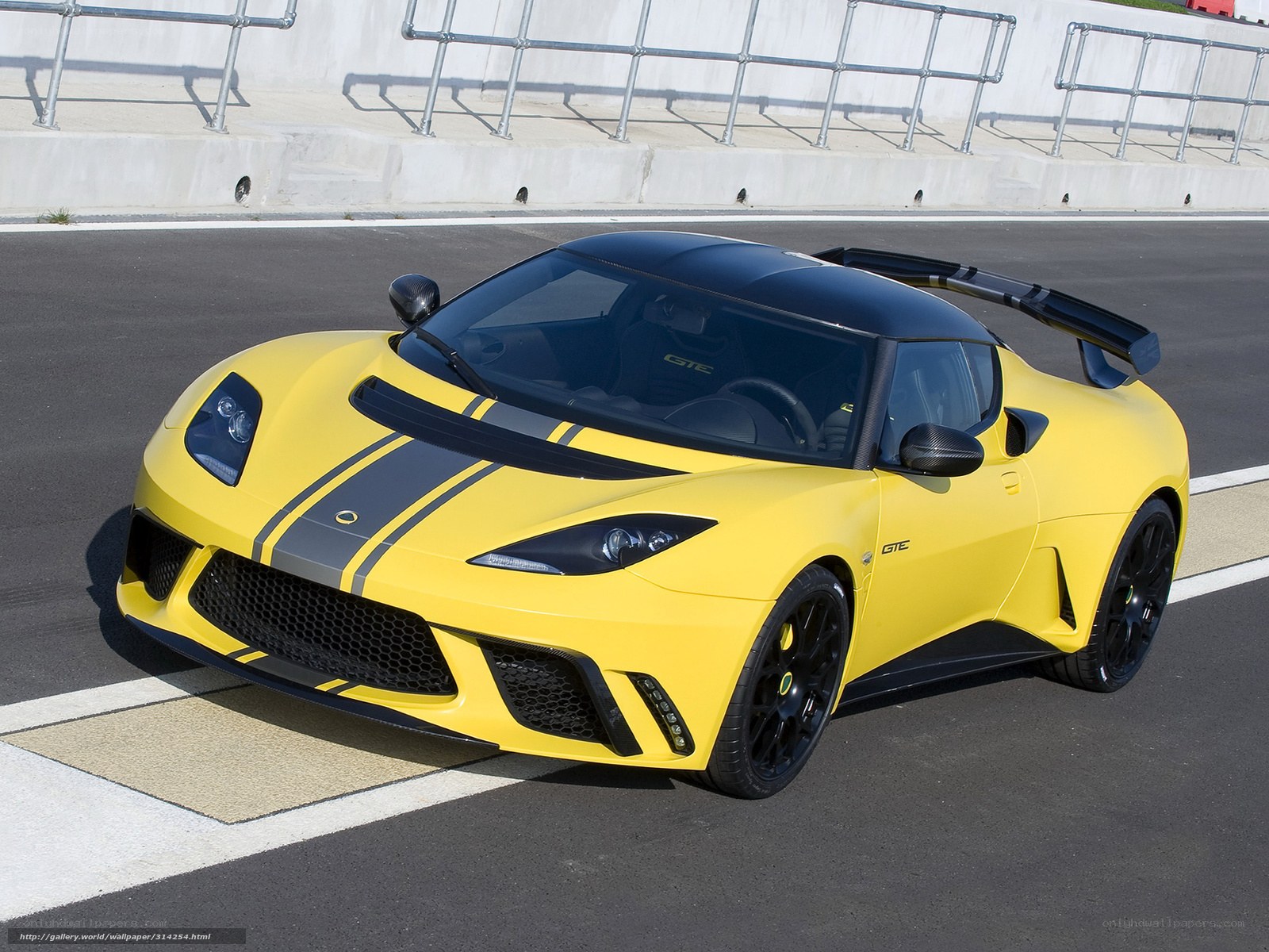 Yellow Lotus sports car on track
