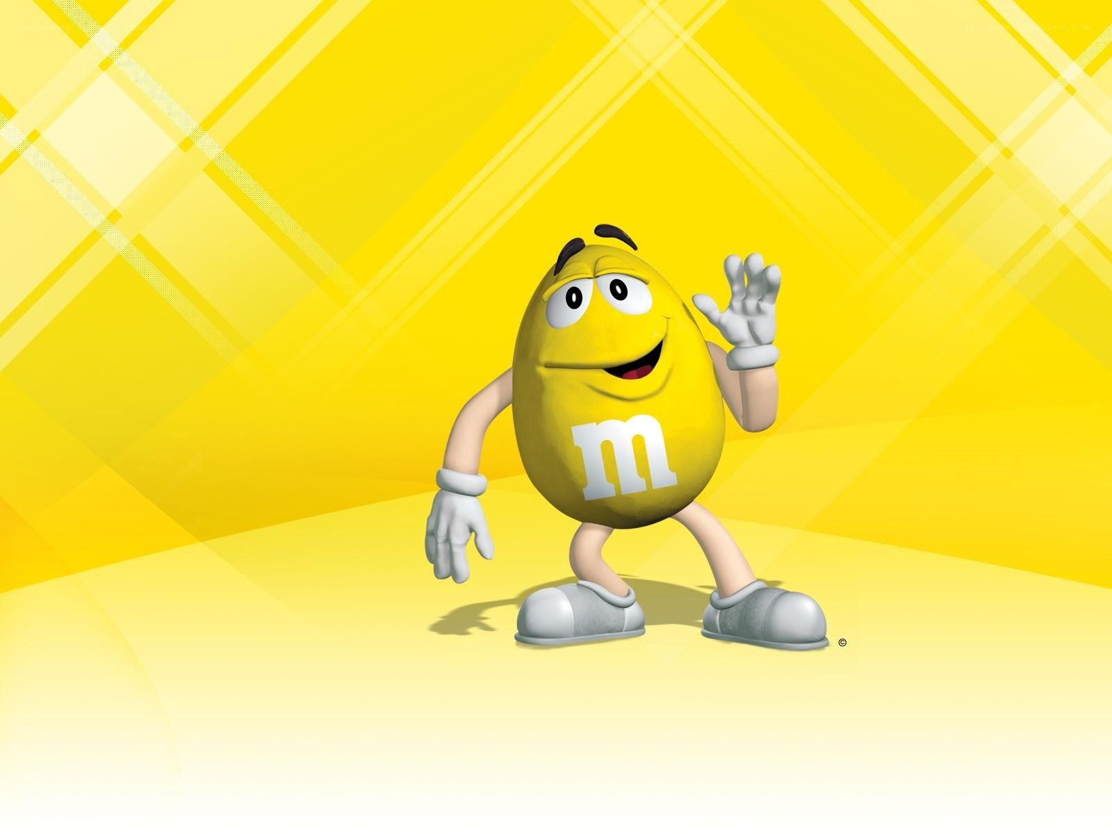 Yellow M&M character waving