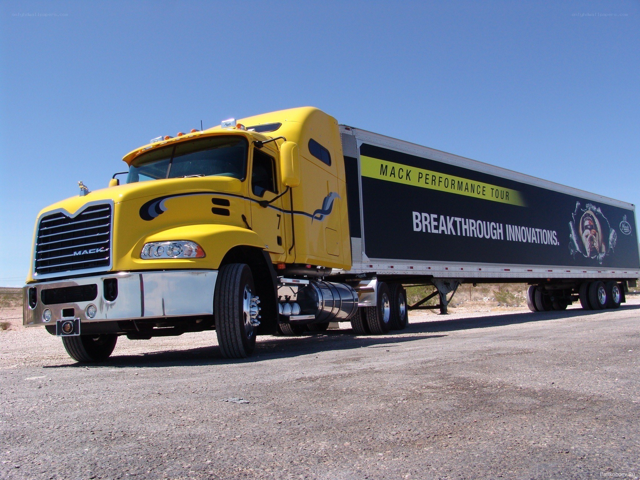 Yellow Mack truck with trailer