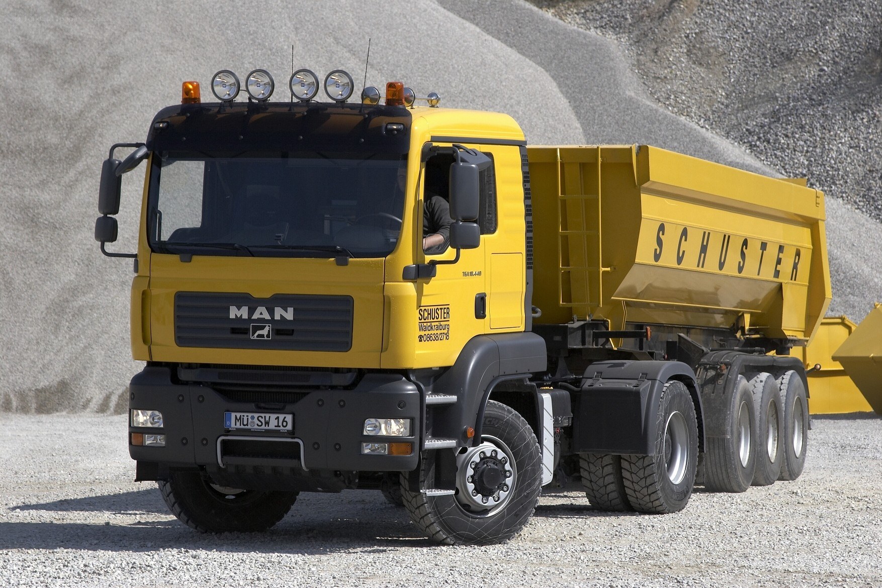 Yellow MAN dump truck