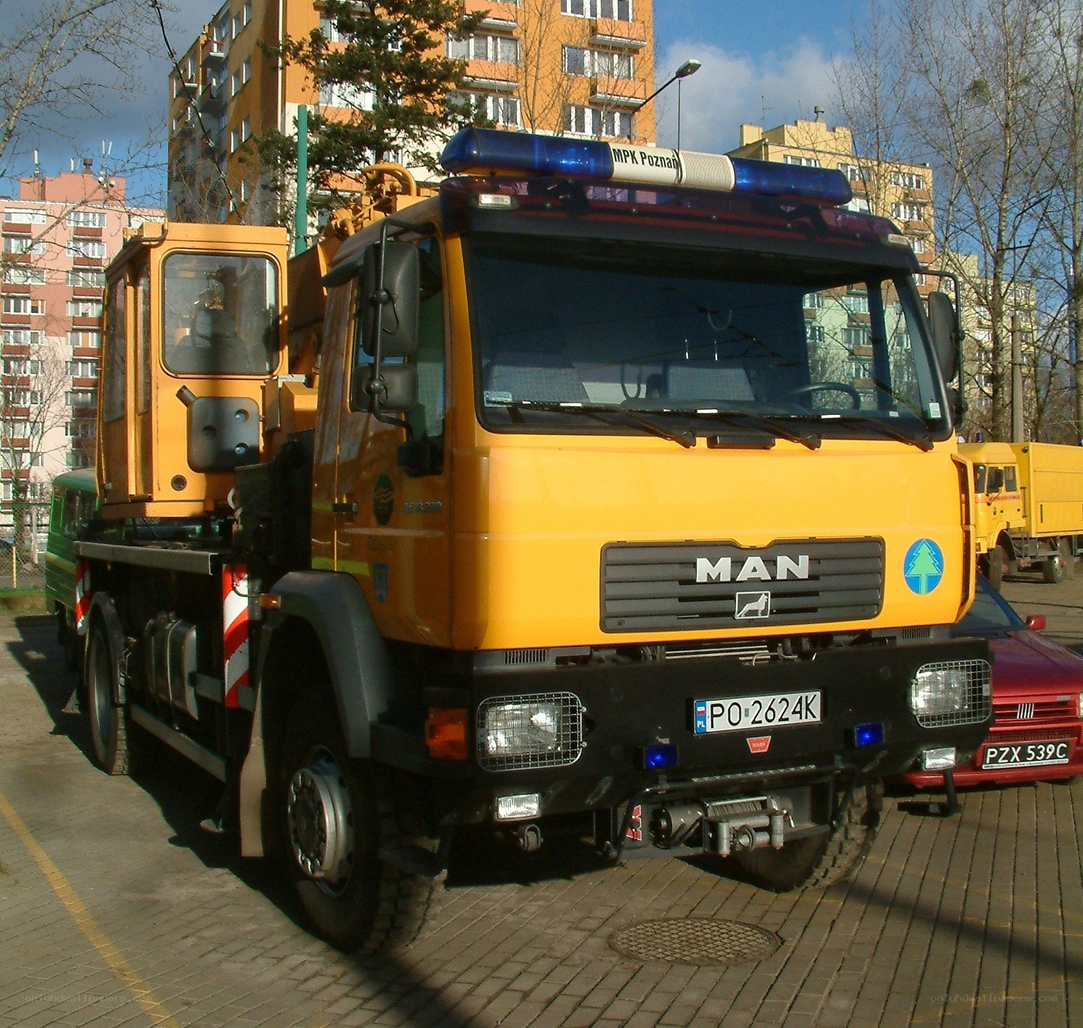 Yellow MAN truck with crane