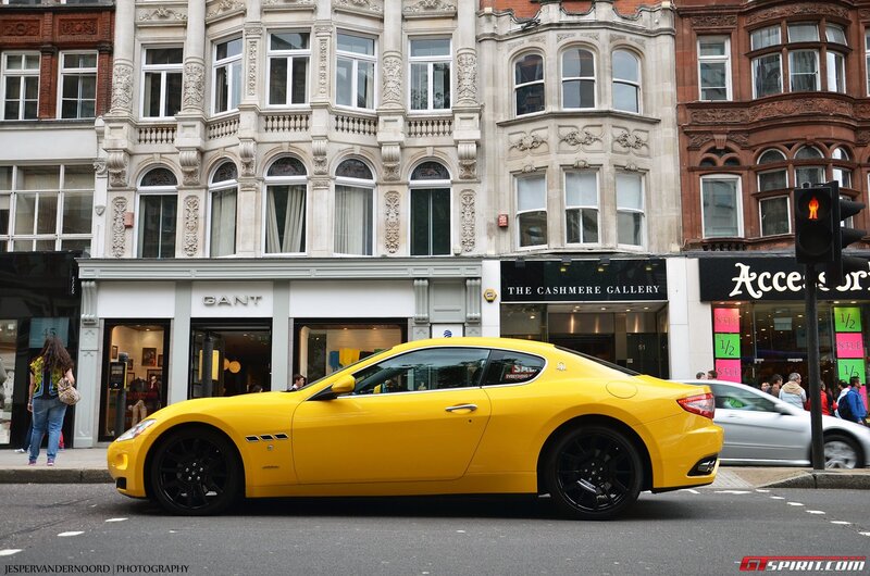 Yellow Maserati on city street