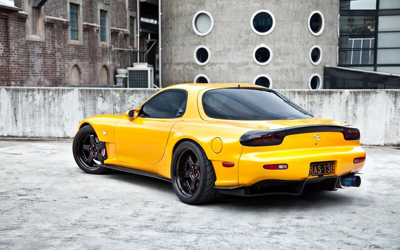 Yellow Mazda RX-7 sports car