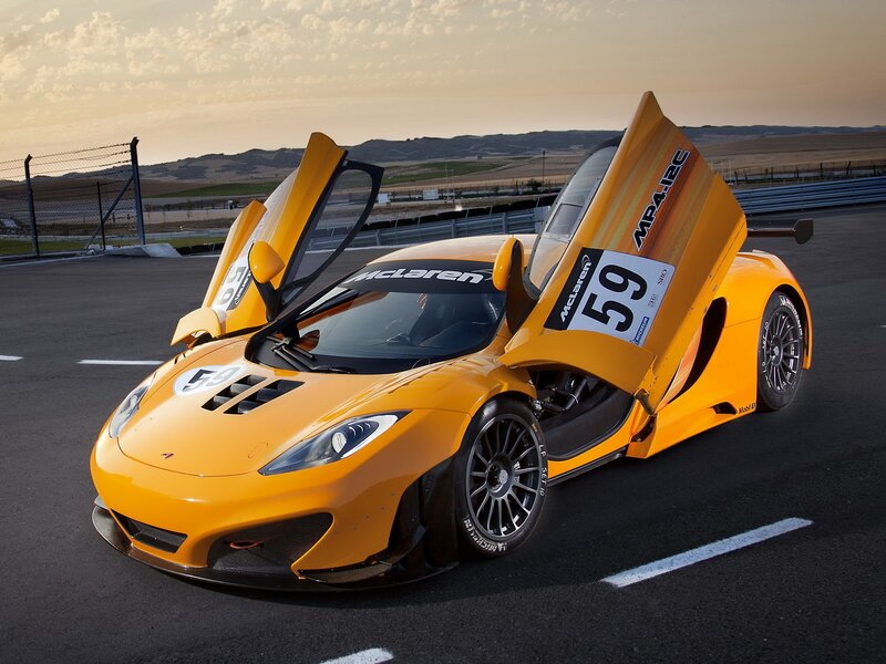 Yellow McLaren MP4-12C on track