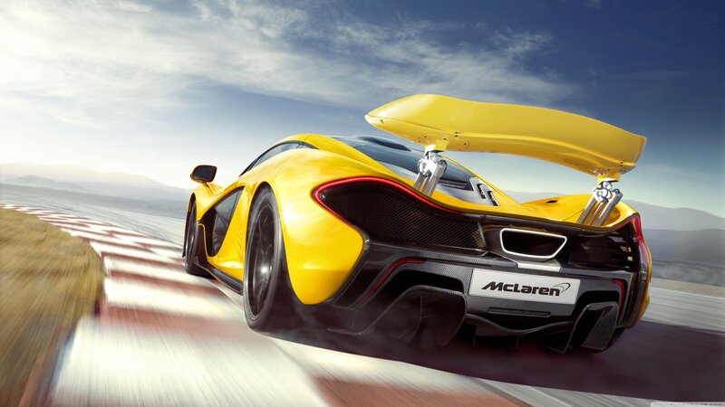 Yellow McLaren on a racetrack