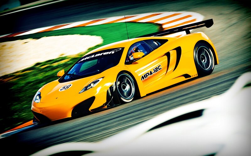 Yellow McLaren on a racetrack
